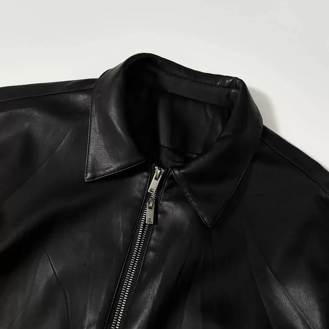 Black leather (or faux-leather) bomber-style jacket