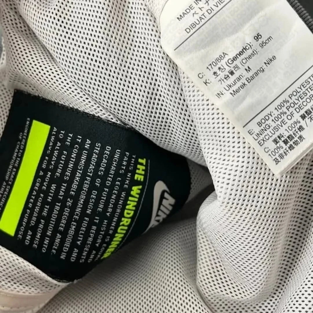 heavily customized or "reworked" vintage Nike nylon windbreaker jacket