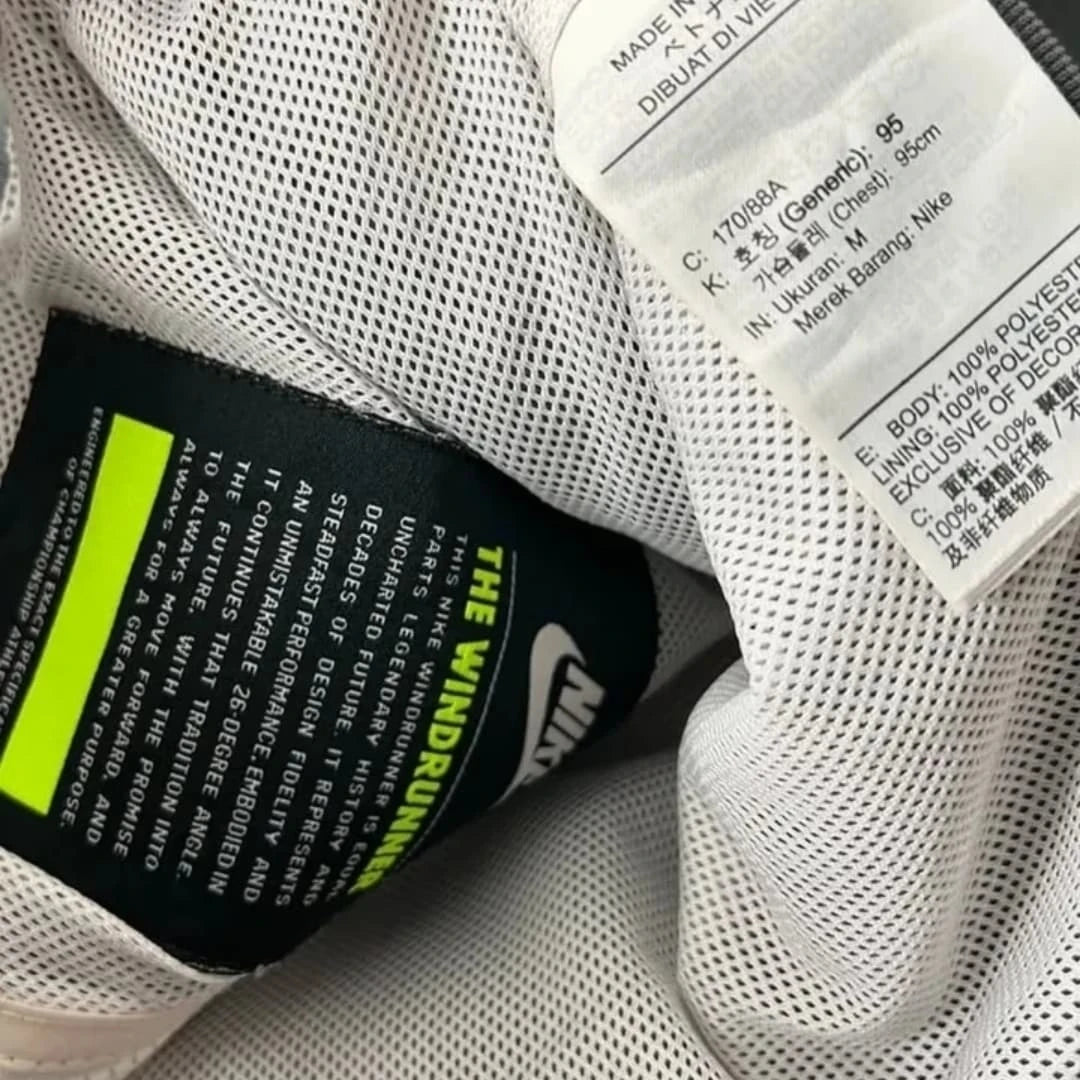 heavily customized or "reworked" vintage Nike nylon windbreaker jacket