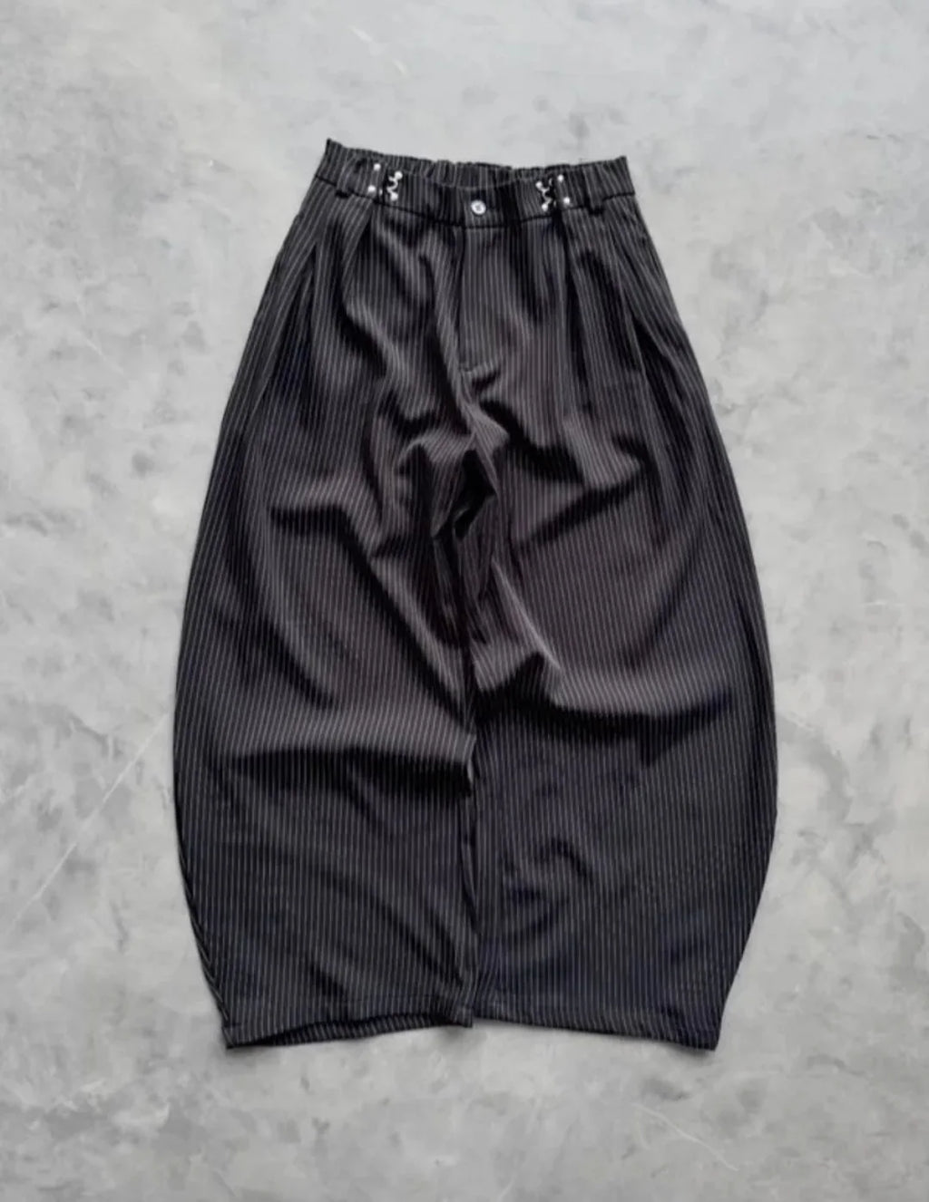 pinstripe trousers combine classic tailoring with modern streetwear elements