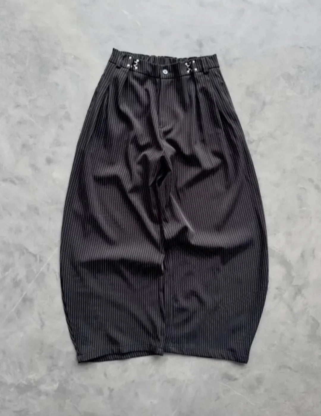pinstripe trousers combine classic tailoring with modern streetwear elements