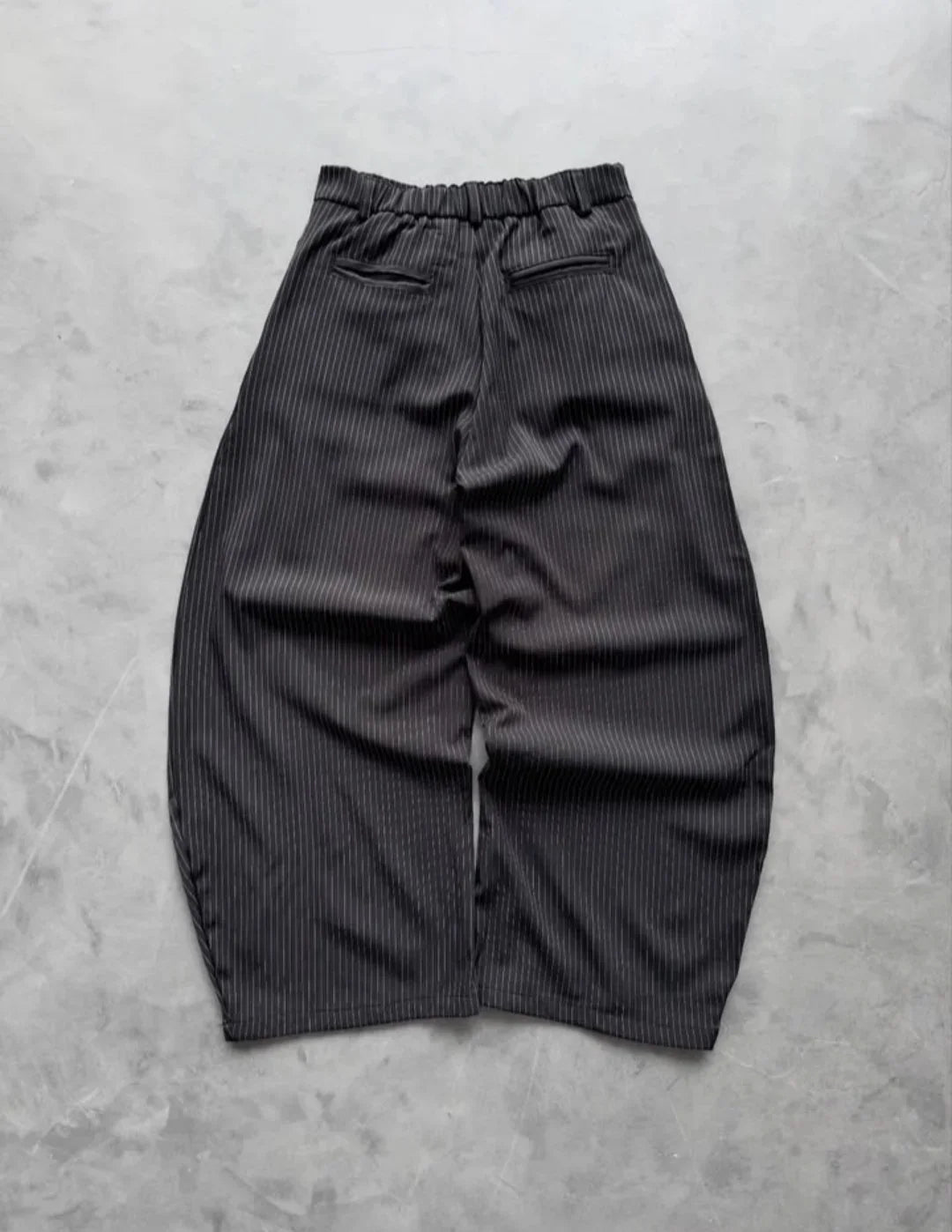 pinstripe trousers combine classic tailoring with modern streetwear elements