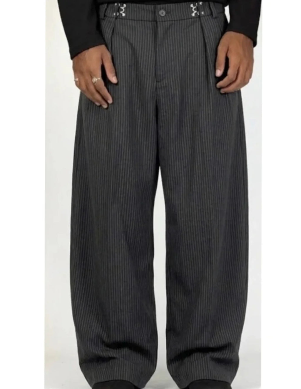 pinstripe trousers combine classic tailoring with modern streetwear elements
