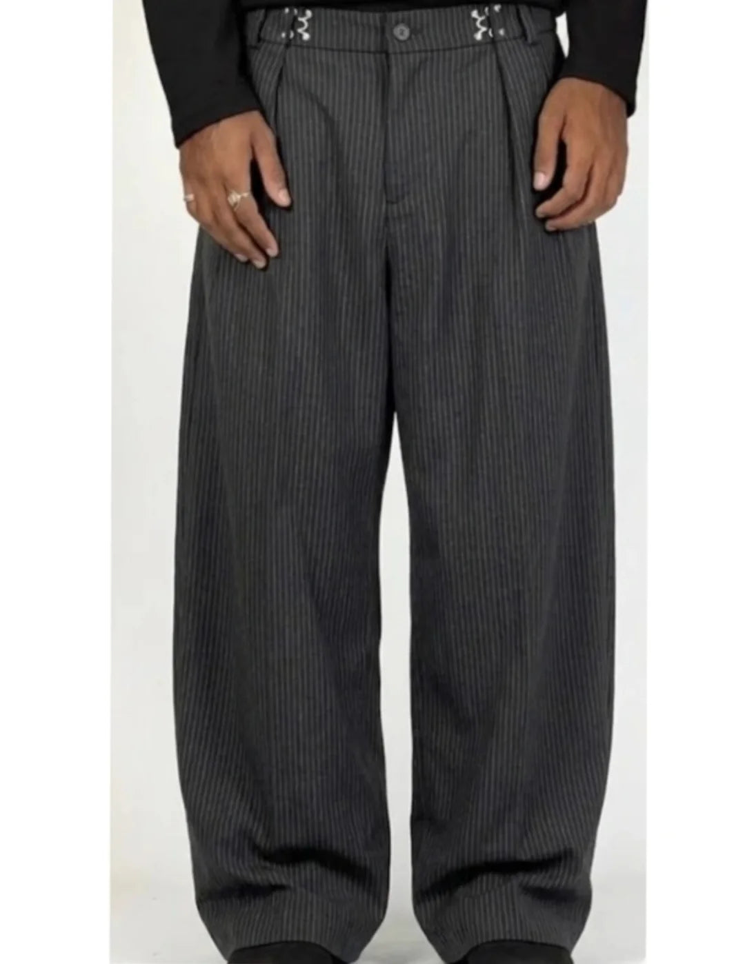 pinstripe trousers combine classic tailoring with modern streetwear elements