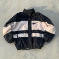 vintage Nike windbreaker embodies a classic streetwear aesthetic