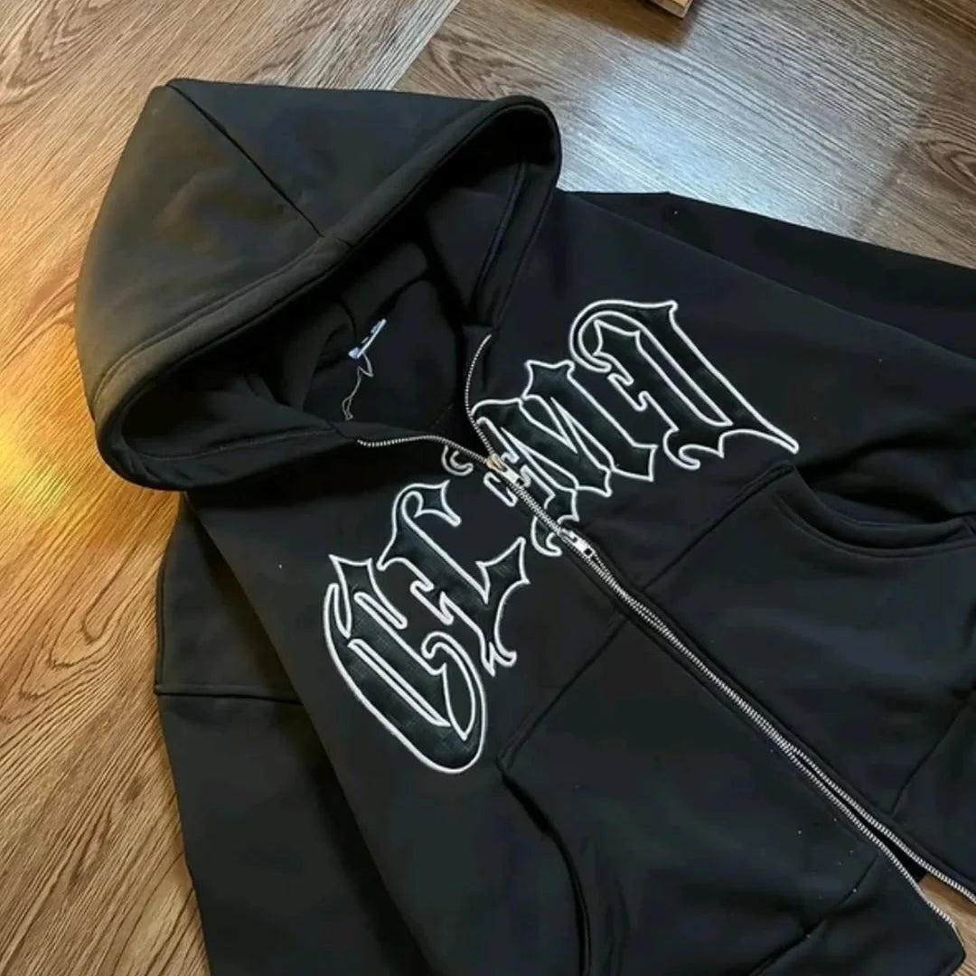 boxy-fit, black zip-up hoodie featuring Gothic/Old English style lettering
