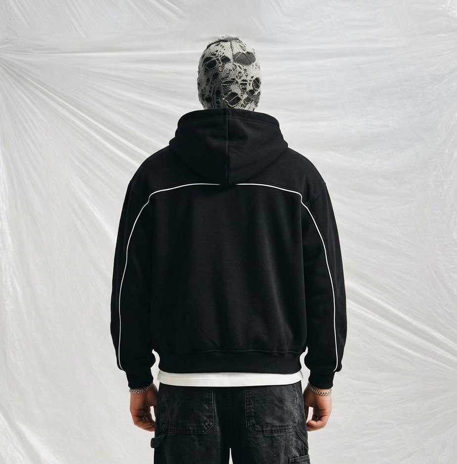 boxy-fit, black zip-up hoodie featuring Gothic/Old English style lettering