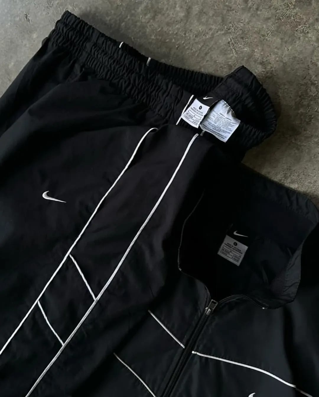 all-black Nike windbreaker set