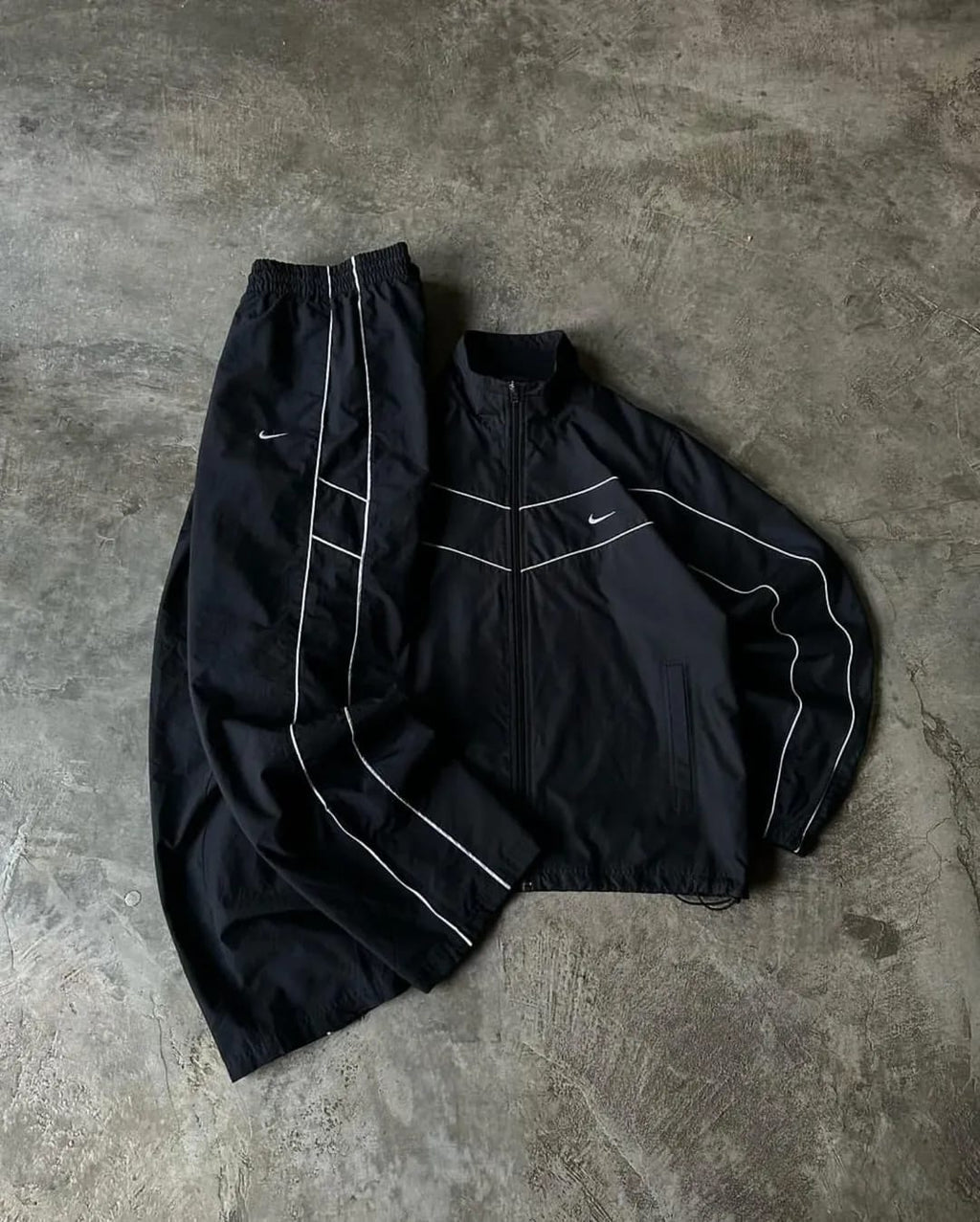 all-black Nike windbreaker set