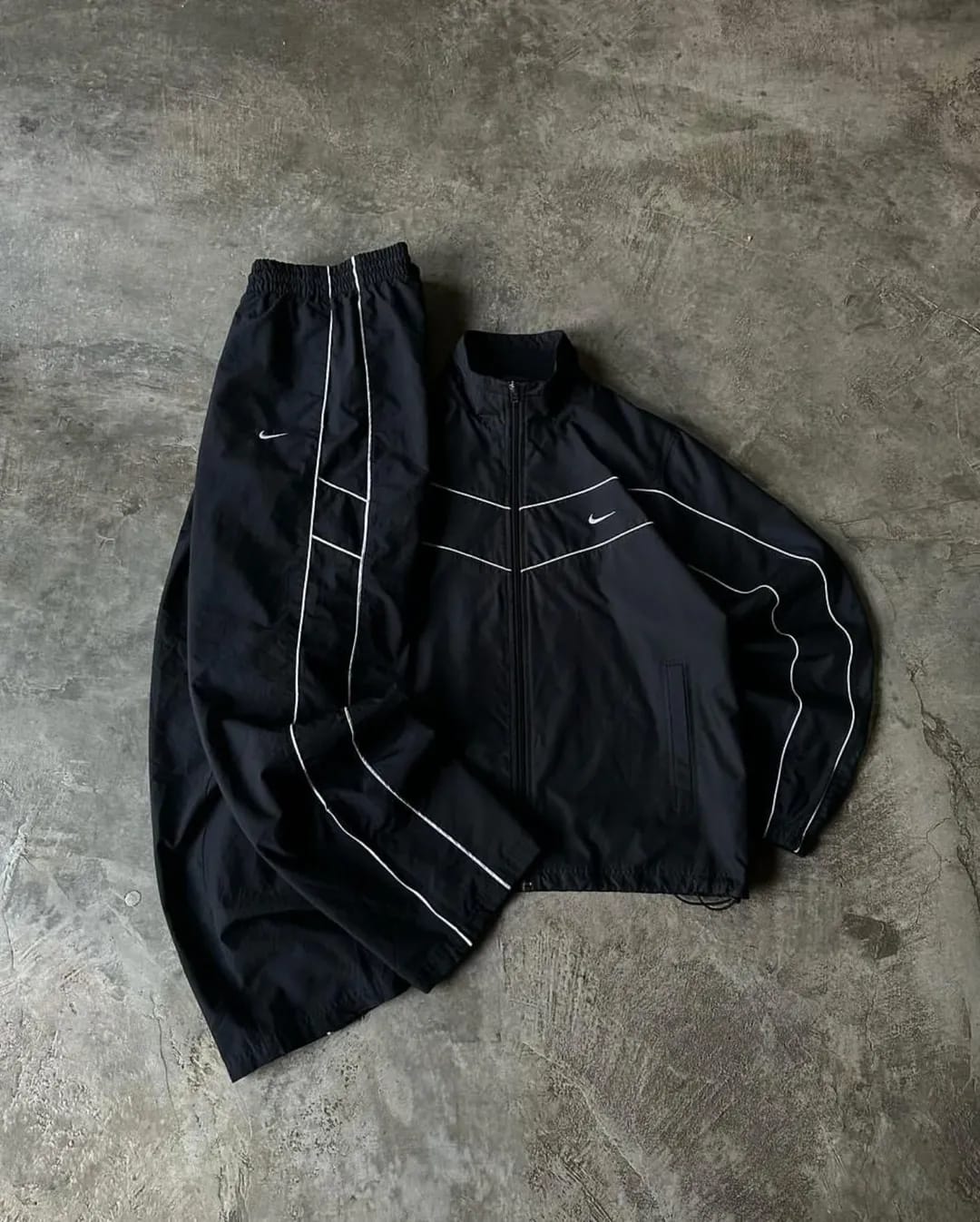all-black Nike windbreaker set