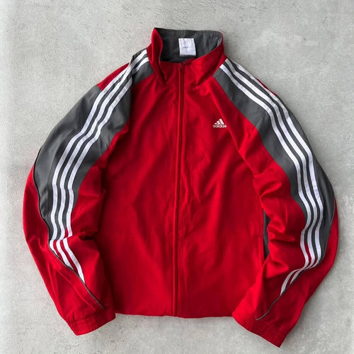 Adidas track jacket with a bold, two-tone athletic design